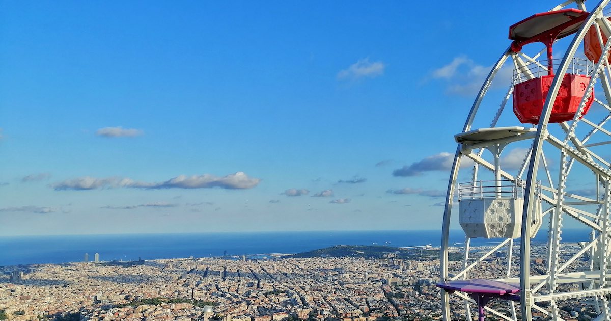 city view of Barcelona behind a ferris wheel