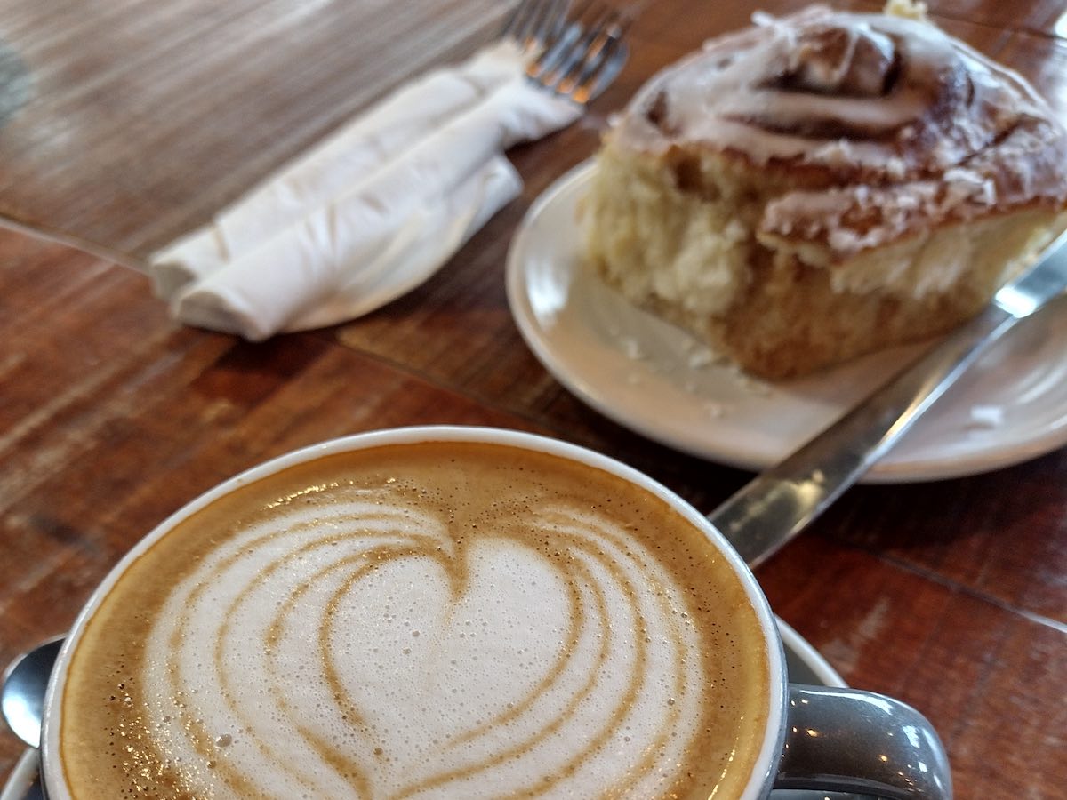 cinnamon roll and coffee at Established coffee Belfast