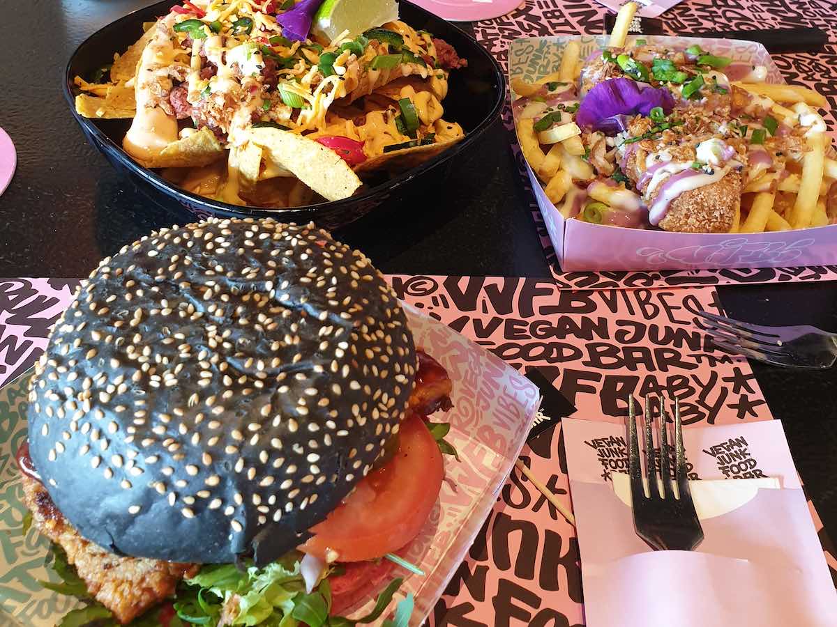 burgers, nachos, and fries at vegan junk food bar