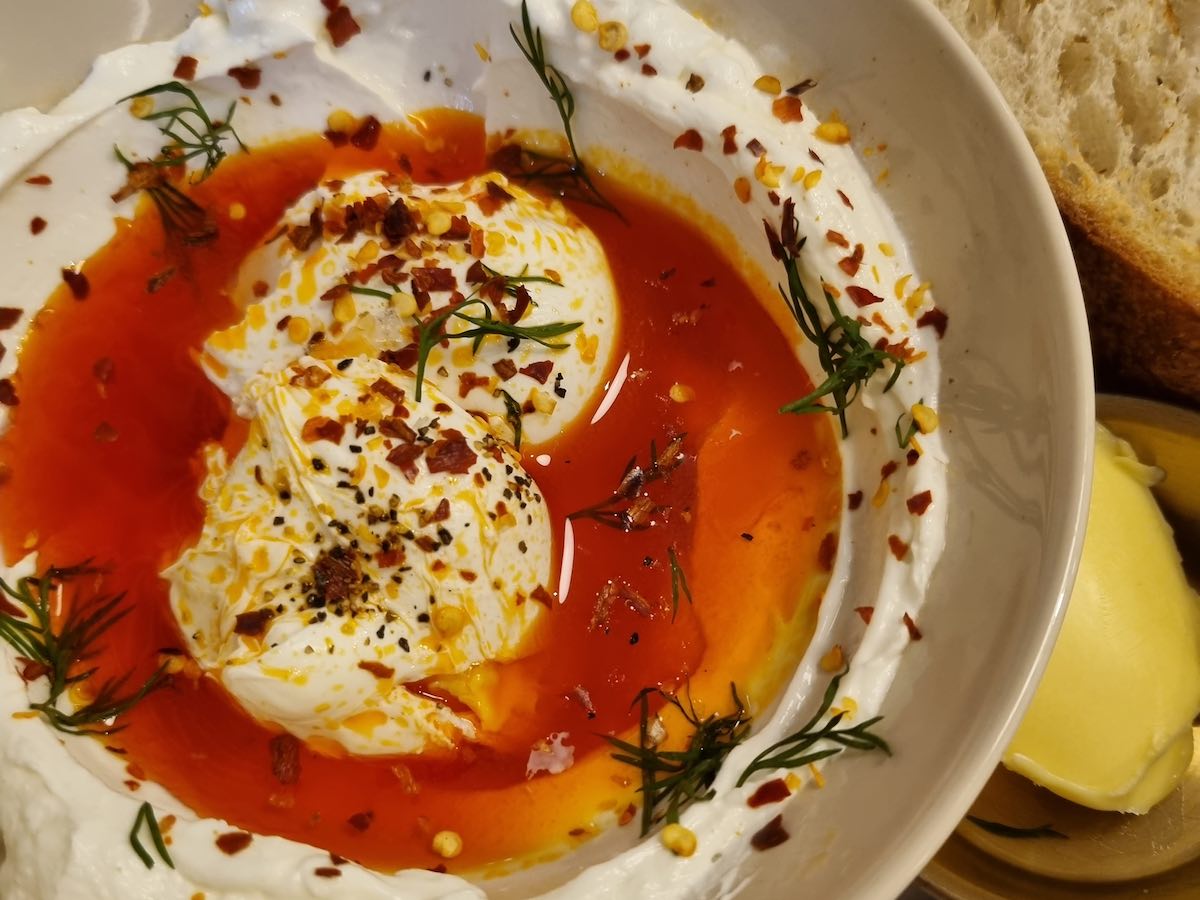 the turkish eggs with chilli butter and dill at the neighbourhood cafe for lunch in Belfast