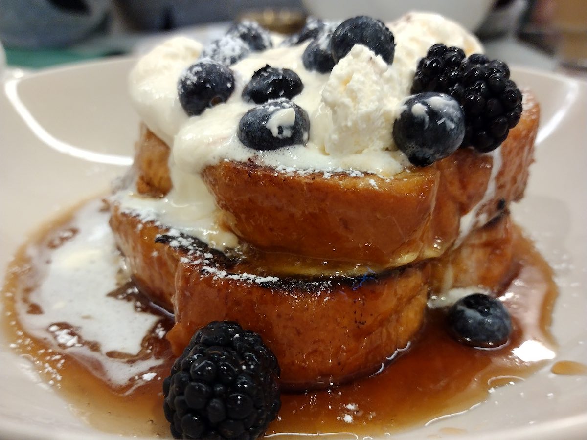 the frech toast at Neighbourhood cafe in Belfast. Covered in syrup, fresh fruit, and vanilla cream.