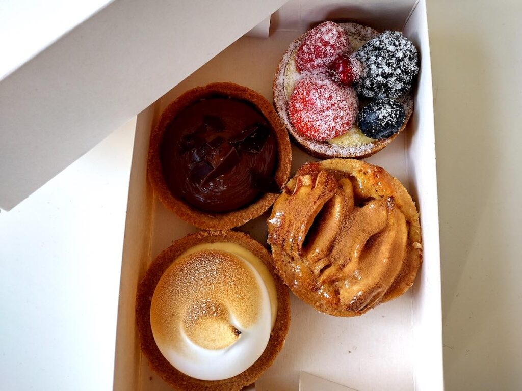 Four tarts from petite gateau bakeries in Amsterdam